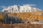 USA, Colorado, Gunnison National Forest. Snow on East Beckwith Mountain and forest in autumn. Art Print